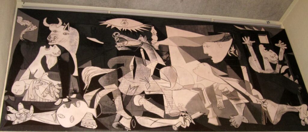 Black and white cubist-style artwork depicting abstract human and animal figures.